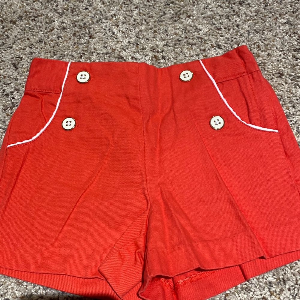 Red/orange shorts. Never been worn